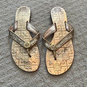 Tory Burch gold glitter logo medallion flip slop sandals